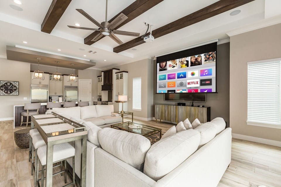 There is a projection screen with a 12-foot auto drop & surround sound for a theater experience