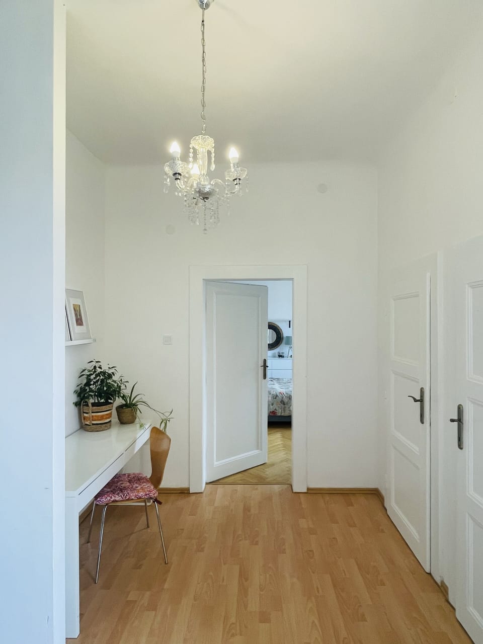 Workspace, bedroom #1, Toilet room, closet and balcony access in center of home.