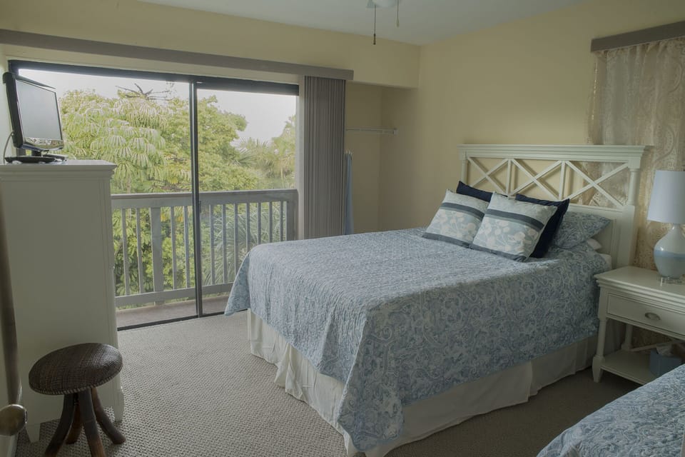 View out bedroom sliders to porch adjoining kitchen