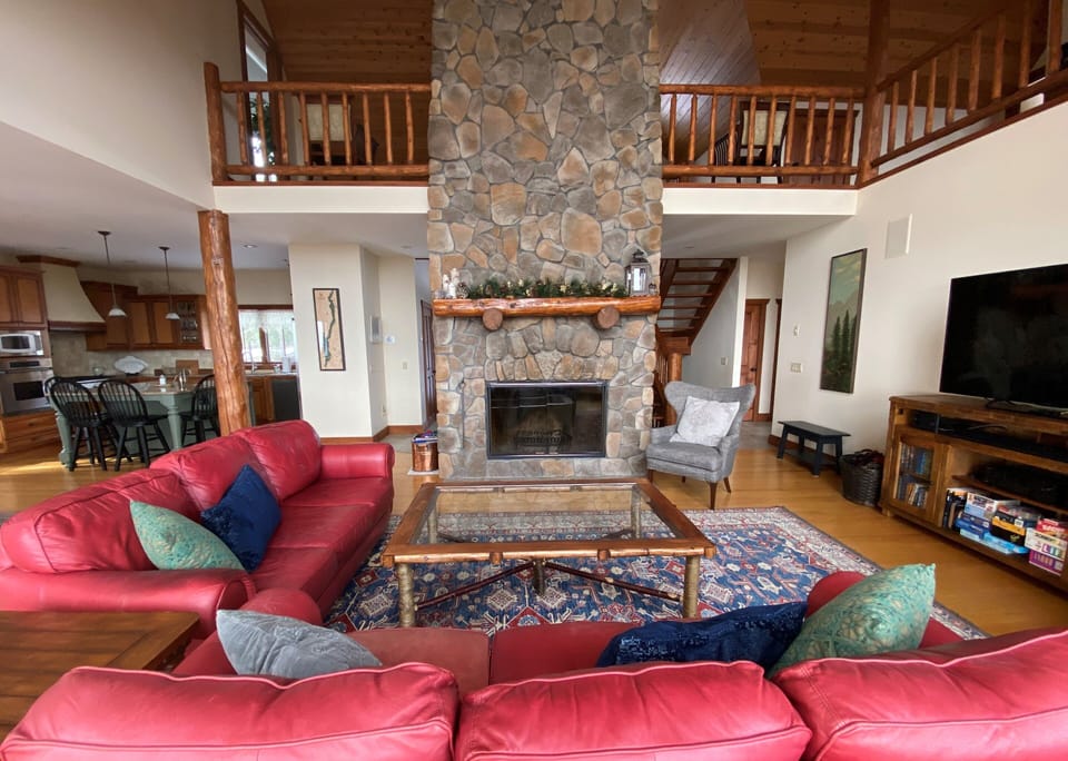 Great Room with large 2 story stone wood burning fireplace (wood provided)