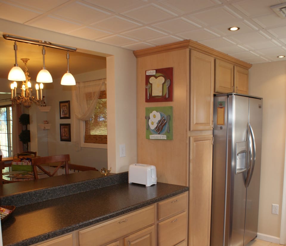 Kitchen Opens to Dining Area with a Breakfast Bar