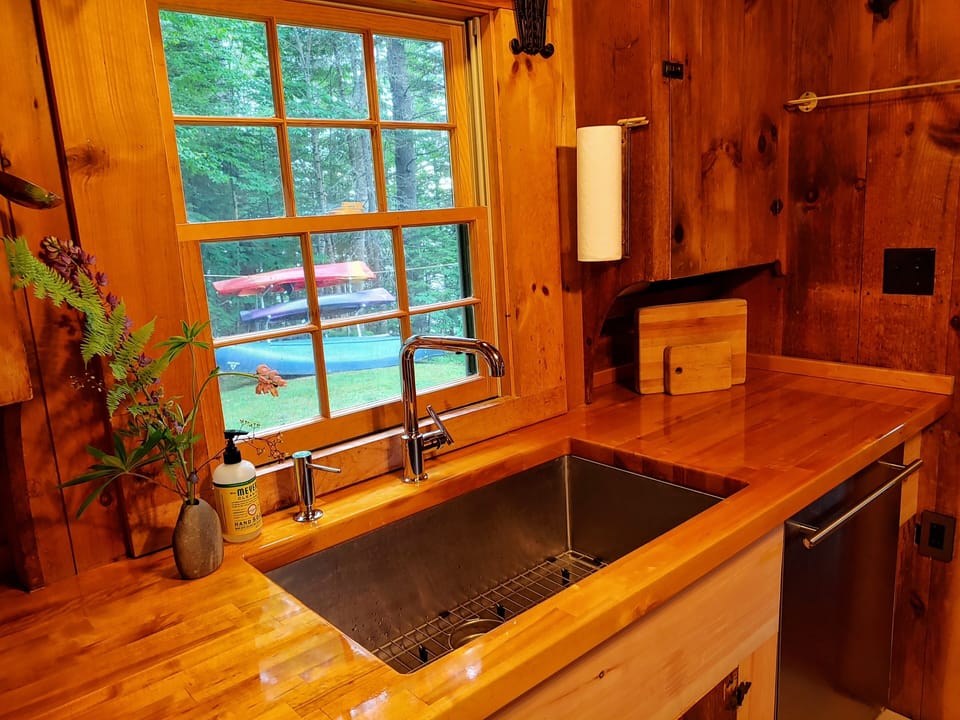 An Asko Dishwasher makes cleanup a breeze in the updated kitchen. 