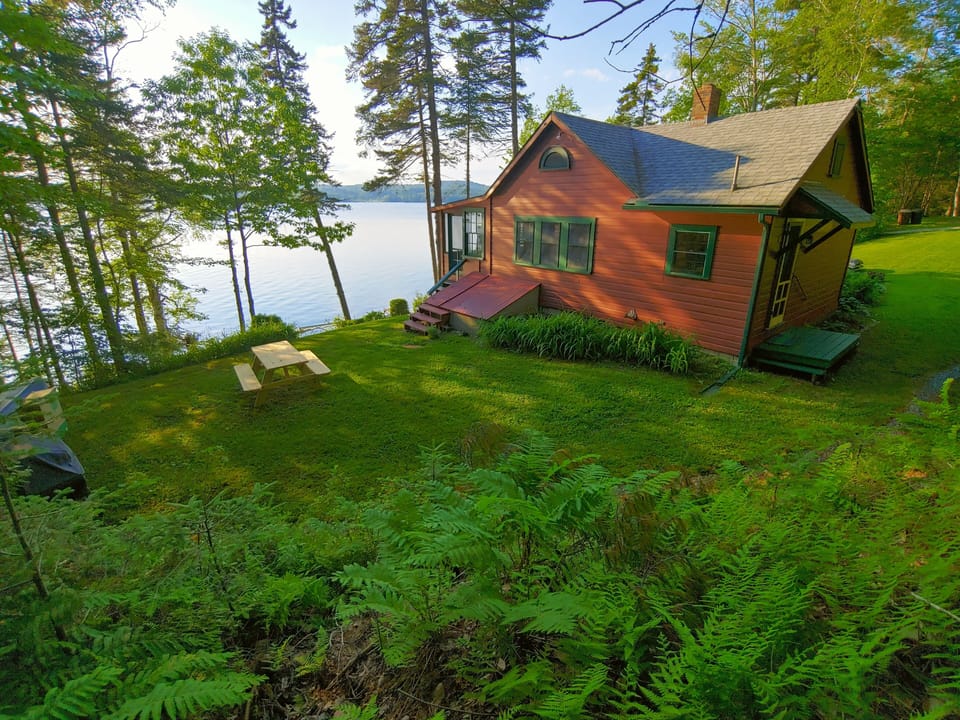 Just steps from the water, listen to the waves from the screened in porch.