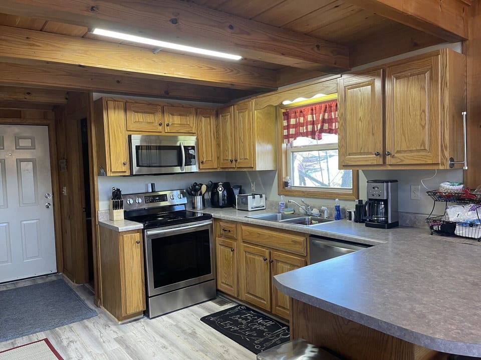 Fully stocked kitchen with cookware, plates and all needed accessories.