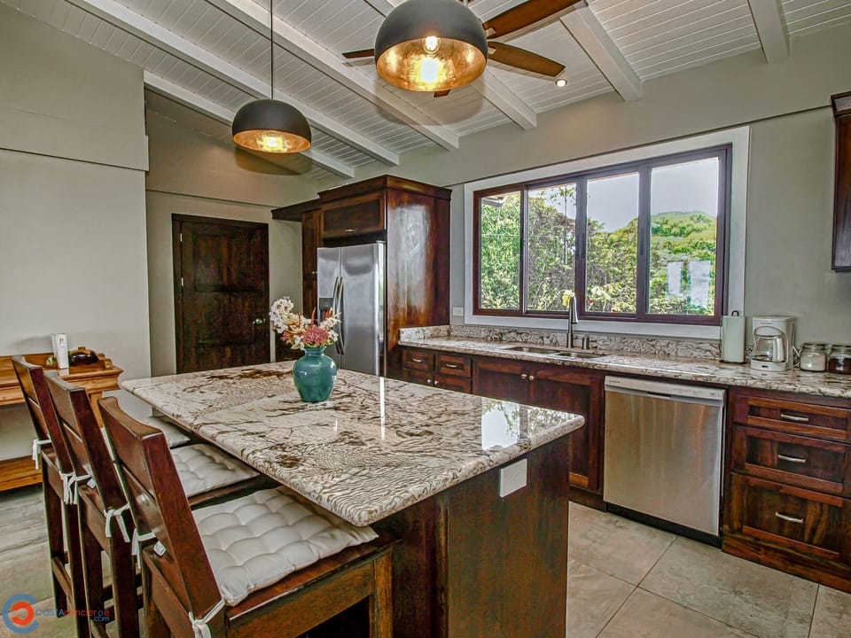 Fully equipped kitchen w/granite countertops, stainless steel appliances. 