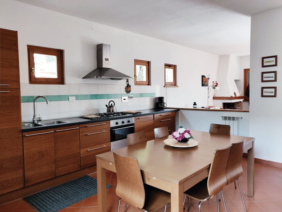 A fully equipped kitchen dining room