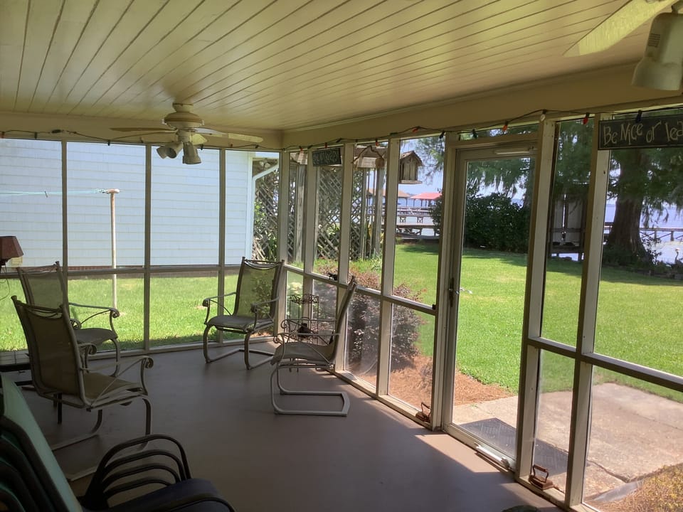 Porch is screened in.  Enjoy the lake breeze free from bugs and mosquitos. 