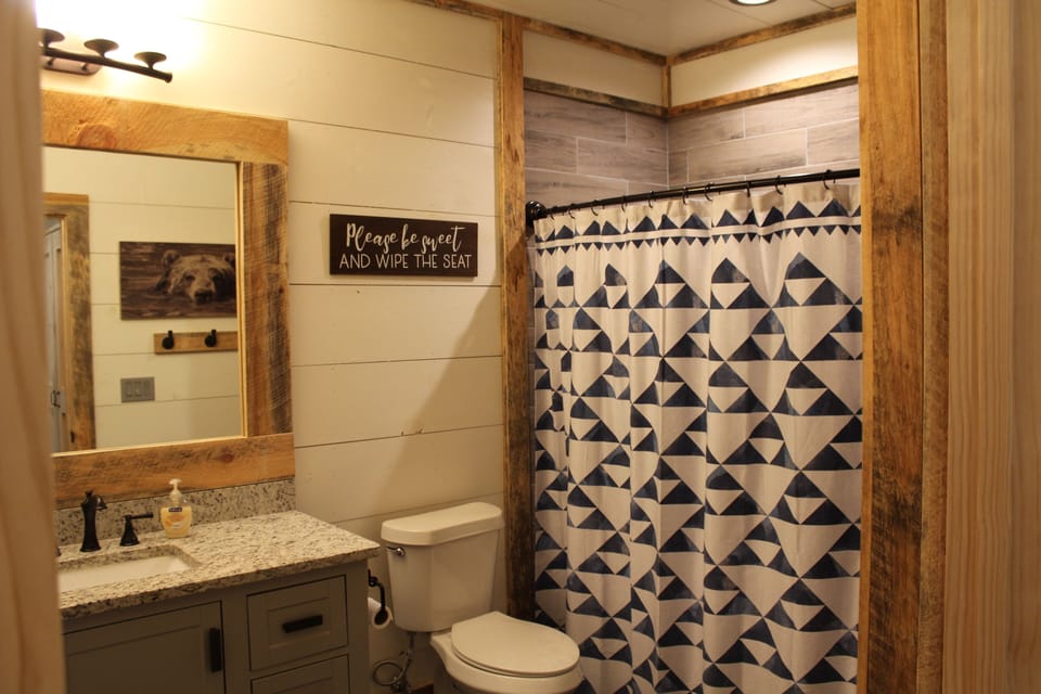 downstairs bathroom with a bathtub/ shower 