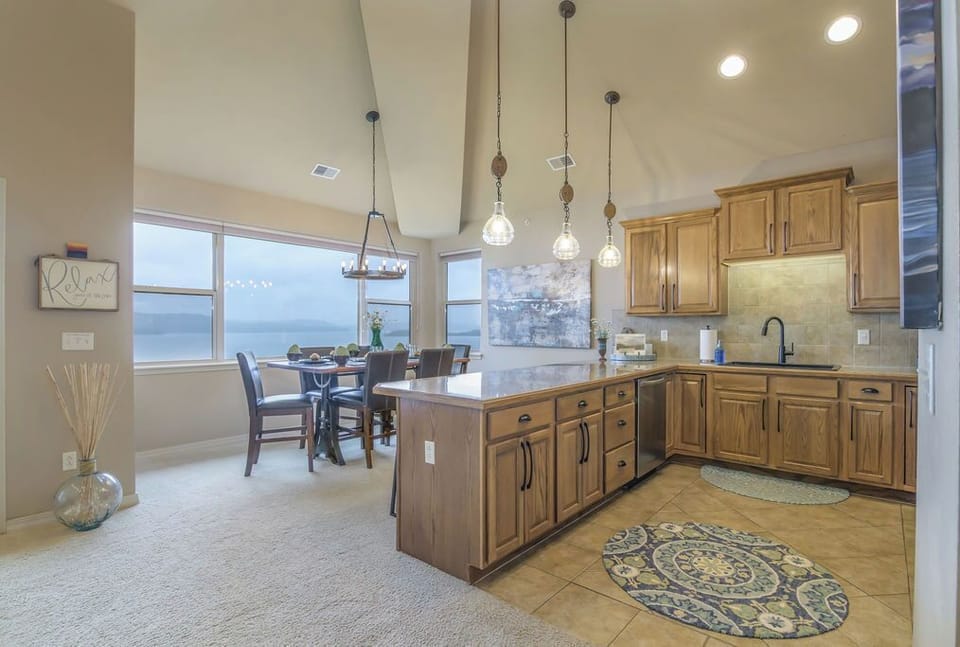 Kitchen and Dinette with seating for six + four more stools at the island. 