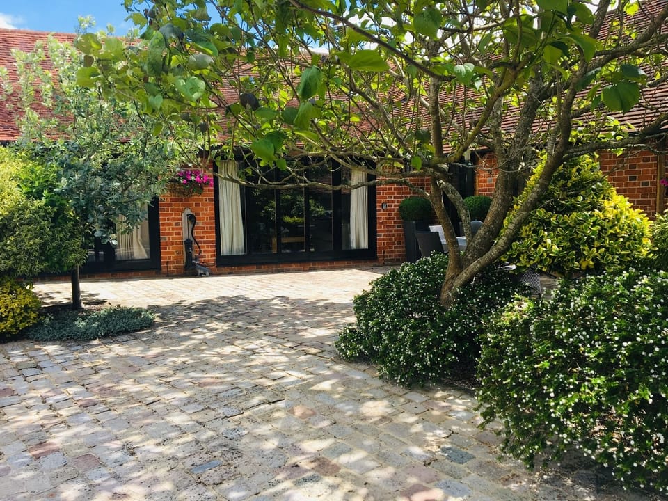 Entrance to accommodation set in pretty courtyard. 