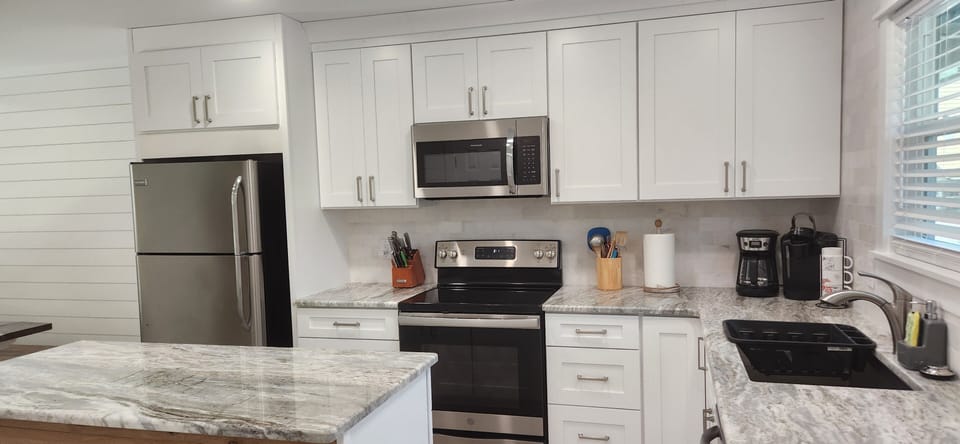 
toaster, mixer/blender, pans, pots, dishes ...