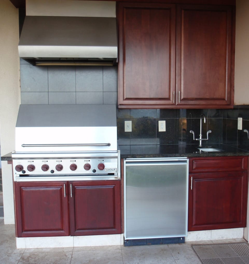 Outdoor Wolf grill, fridge & sink.
