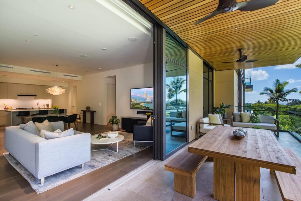 Enjoy seamless indoor-outdoor living with sliding glass doors that lead from the airy living room to your private lanai retreat.