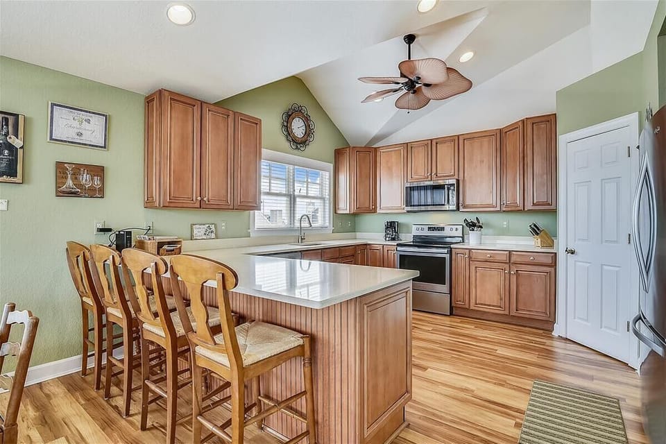 Well stocked kitchen with walk-in pantry and modern appliances.