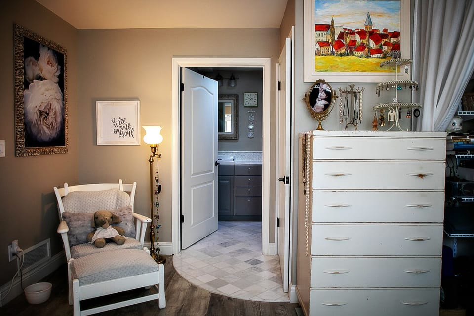 Upstairs has a private space for the toilet and a double sink + shower/tub. 