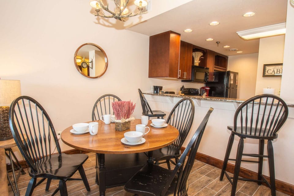 Dining seating with 4-chairs, plus 2 at kitchen counter.