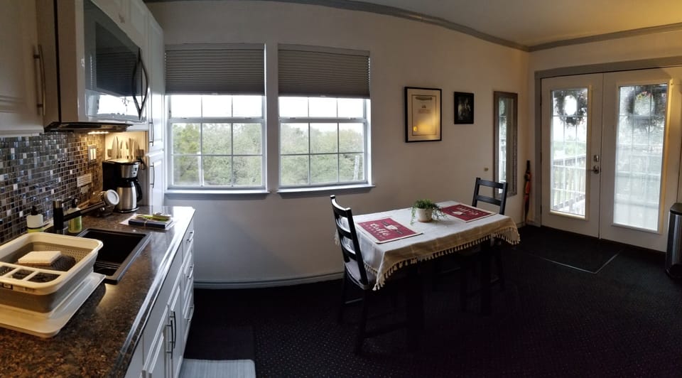 Kitchen and french doors to upper deck