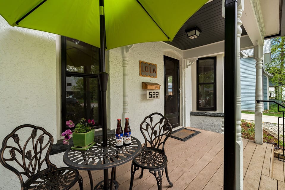 Front Porch with Outdoor Seating and Umbrella