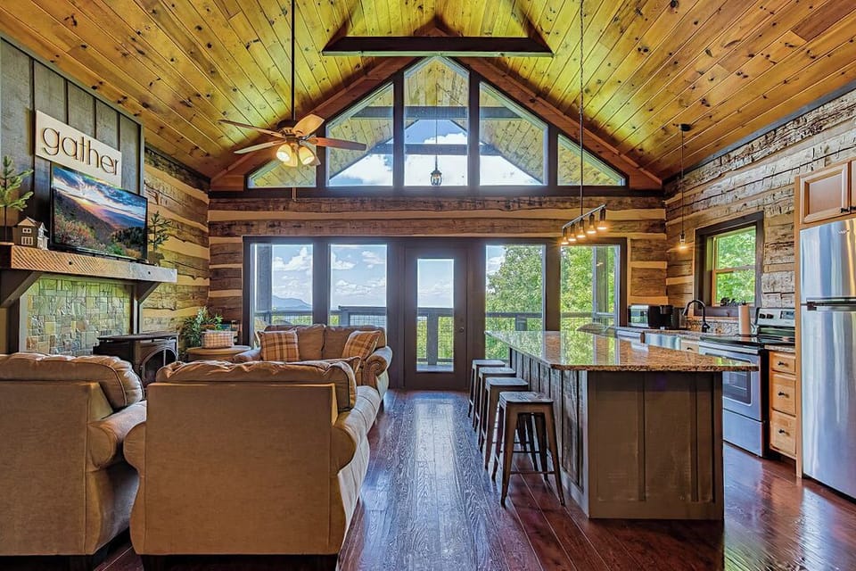 Cozy living area with fireplace and stunning mountain scenery