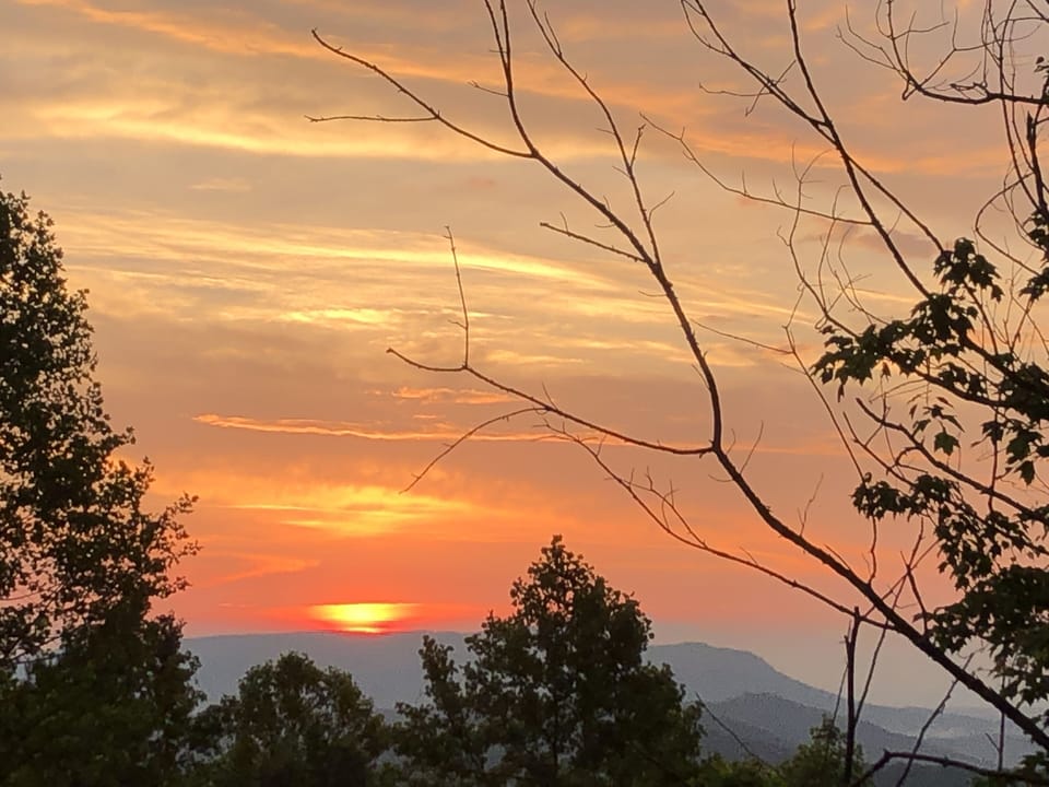 Cabin sunsets with breathtaking colors across the horizon