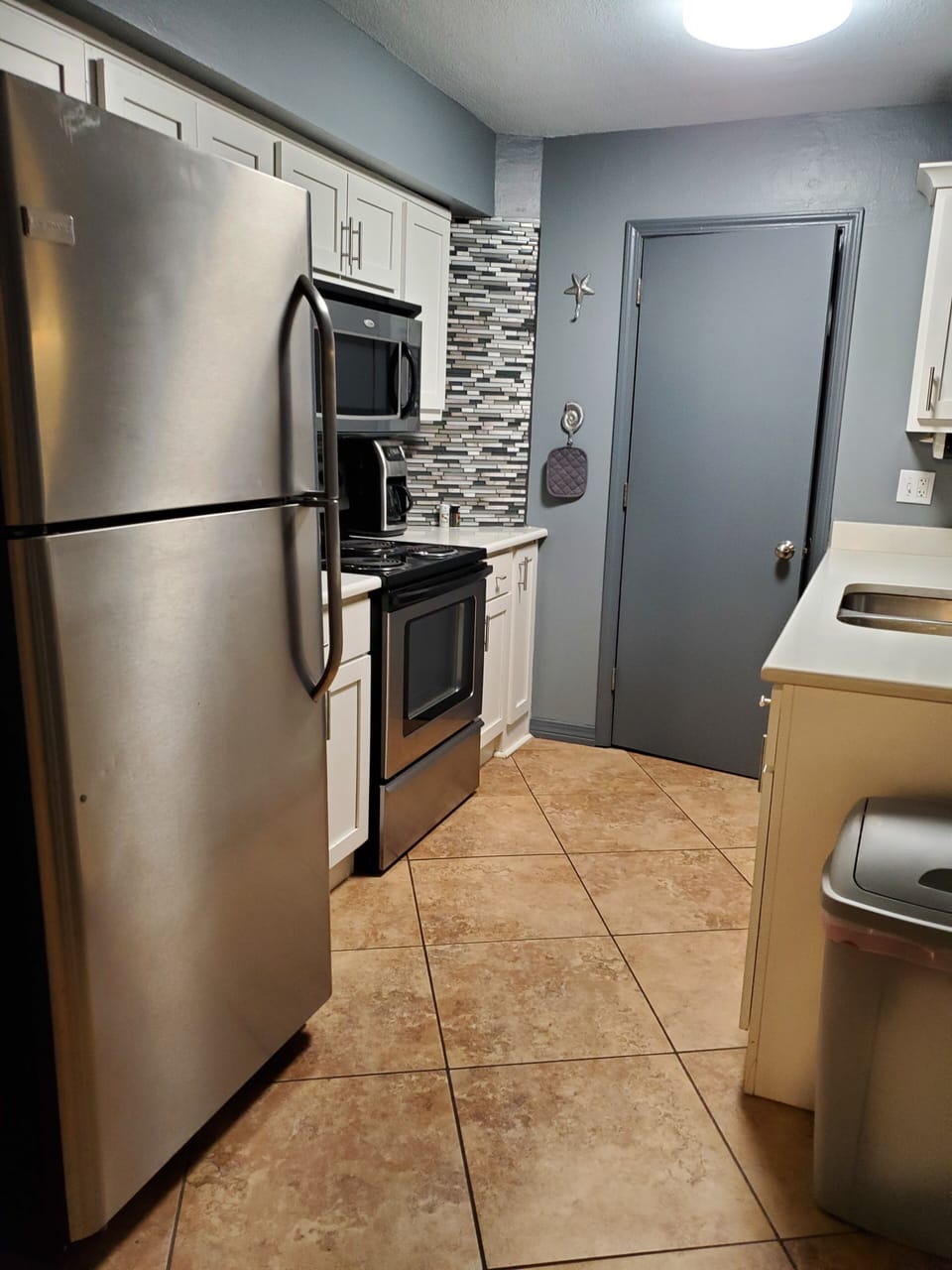 Kitchen view from second bedroom doorway