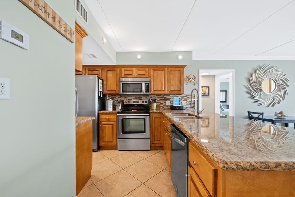 Full kitchen with granite and tons of storage. 