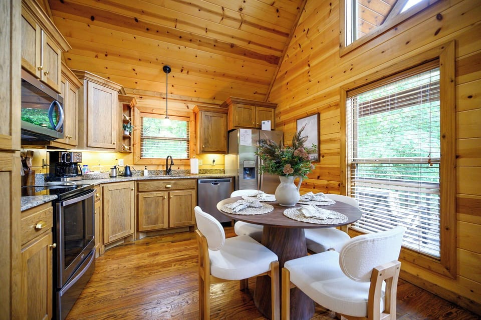 gather around the cozy dining nook for meals with forest views.