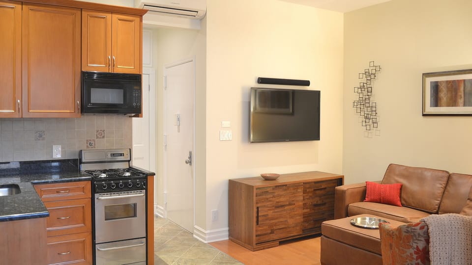 Living Room with Sofa Bed, IP TV, Play Station, Home Theater System & Entrance