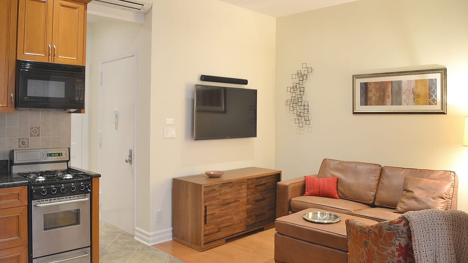 Living Room with Sofa Bed, IP TV, Play Station, Home Theater System & Entrance