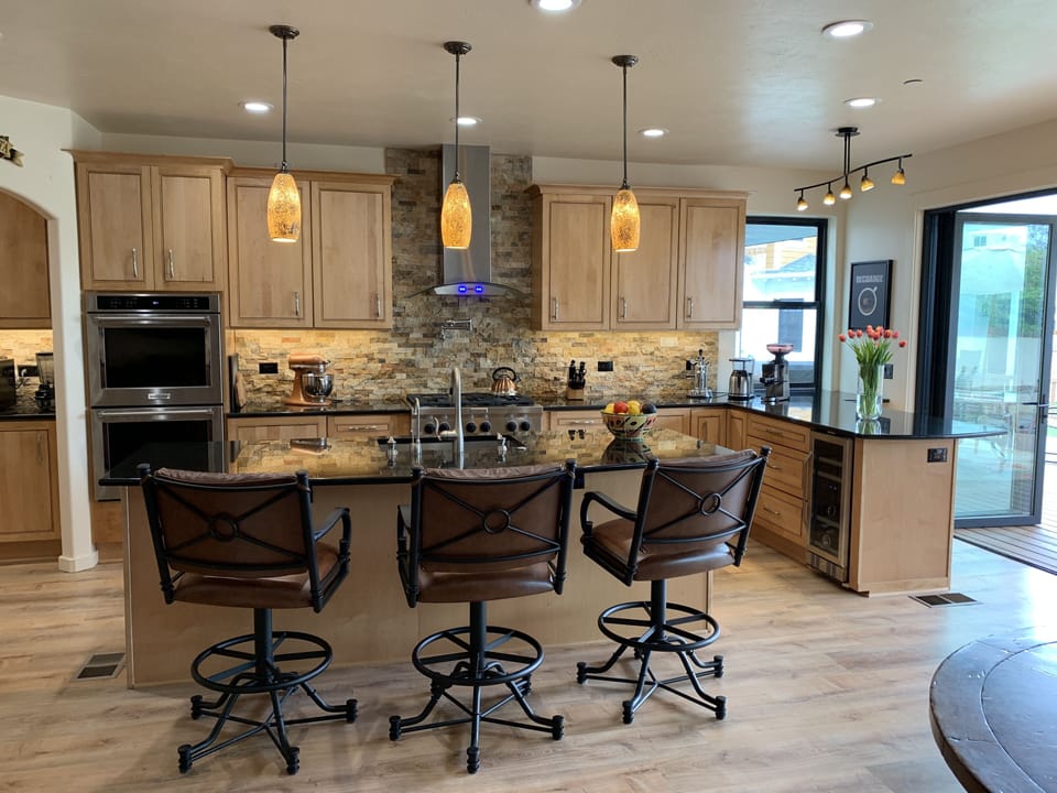 House #1 Kitchen has folding glass doors opening onto deck (R)