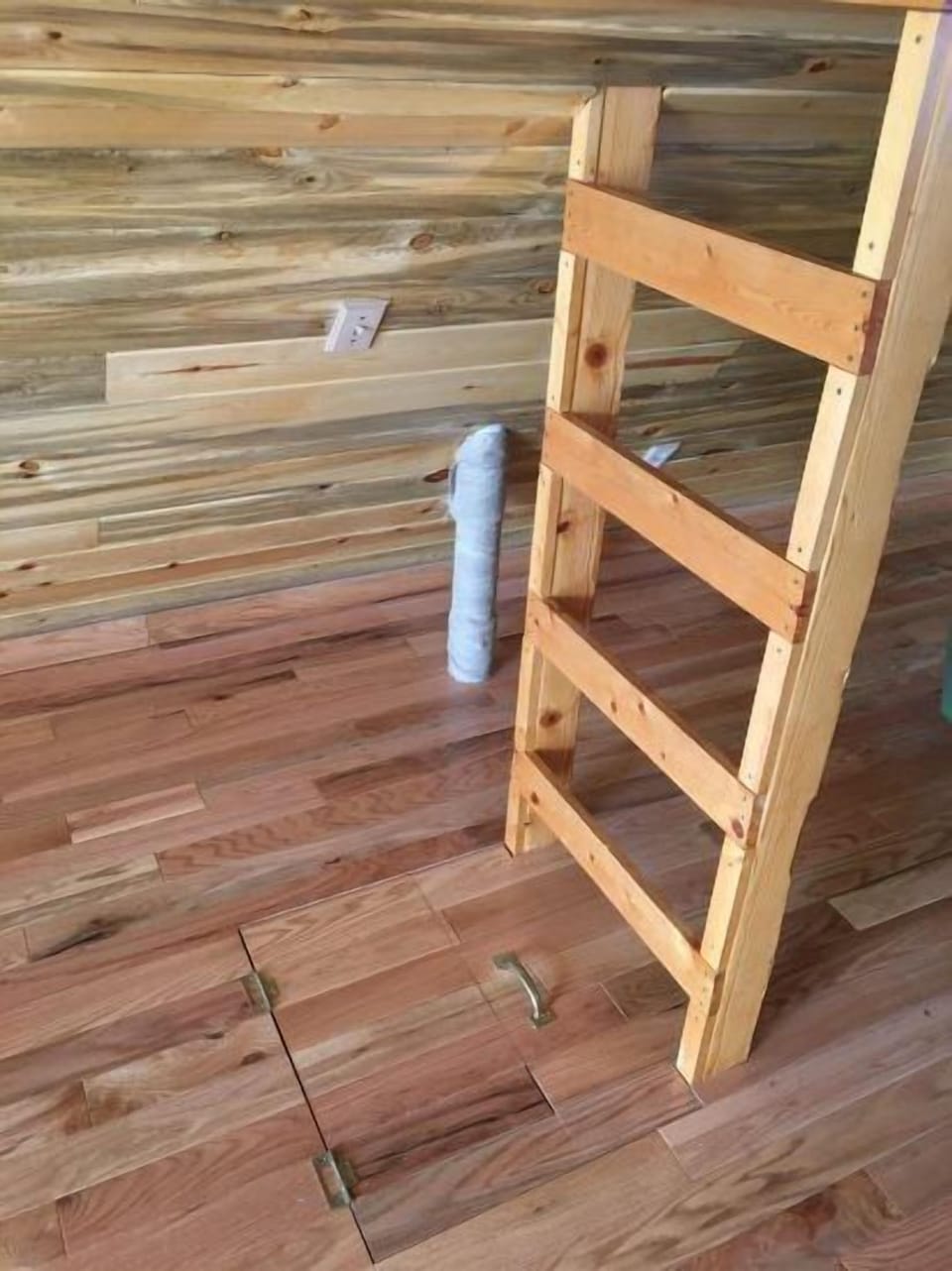 Interior ladder leading to upstairs loft.
