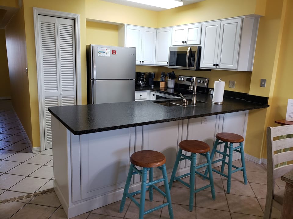 Kitchen with granite counter tops and new stainless appliances