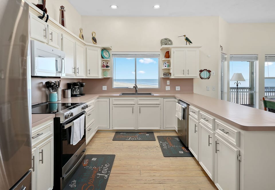 Kitchen has a lot of counter space, window with ocean view.