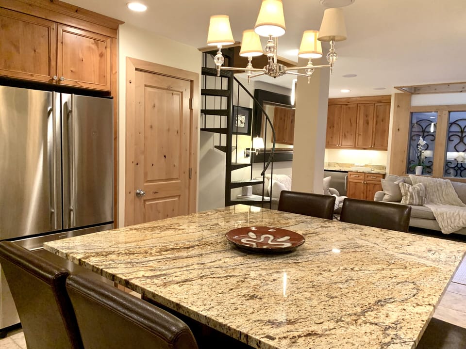 Granite kitchen table looking into living room