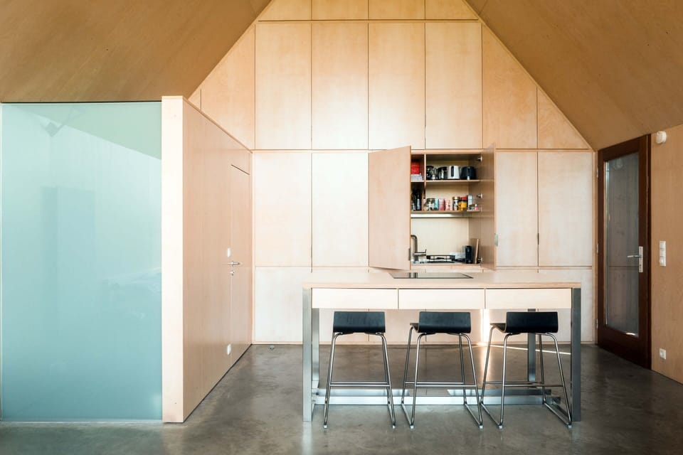 Interior view looking east towards the kitchen and the bathroom.