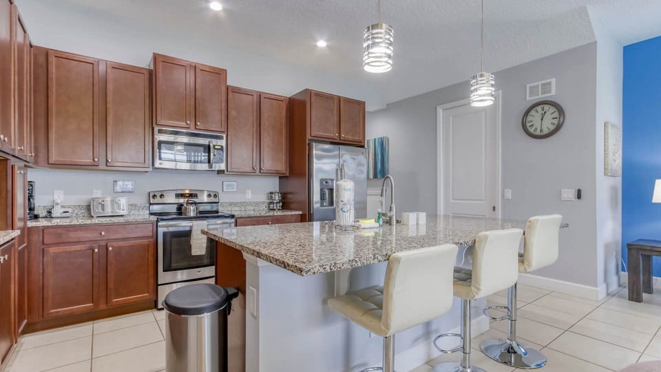 Culinary Connection: Savor the Flavors at the Kitchen Bar with Three Cozy Seats.