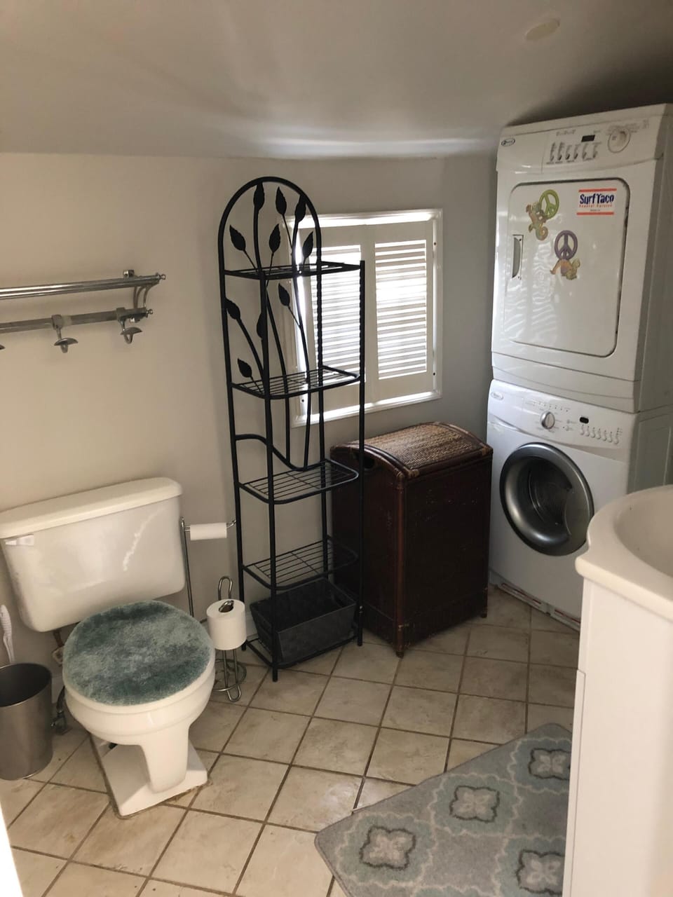 Full bathroom with washer and dryer