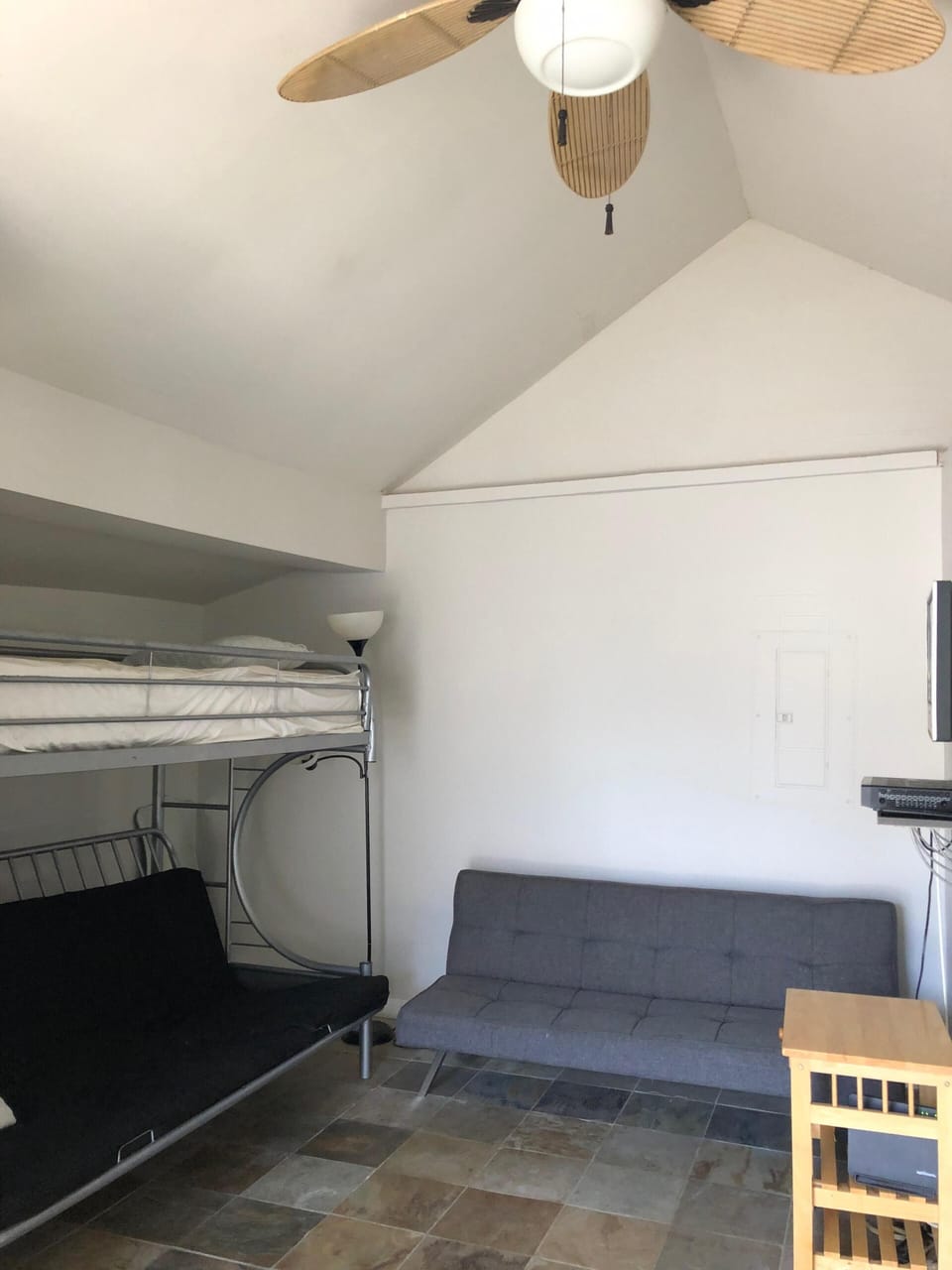 Living Room with queen futon w/ twin bed on top and additional queen futon couch