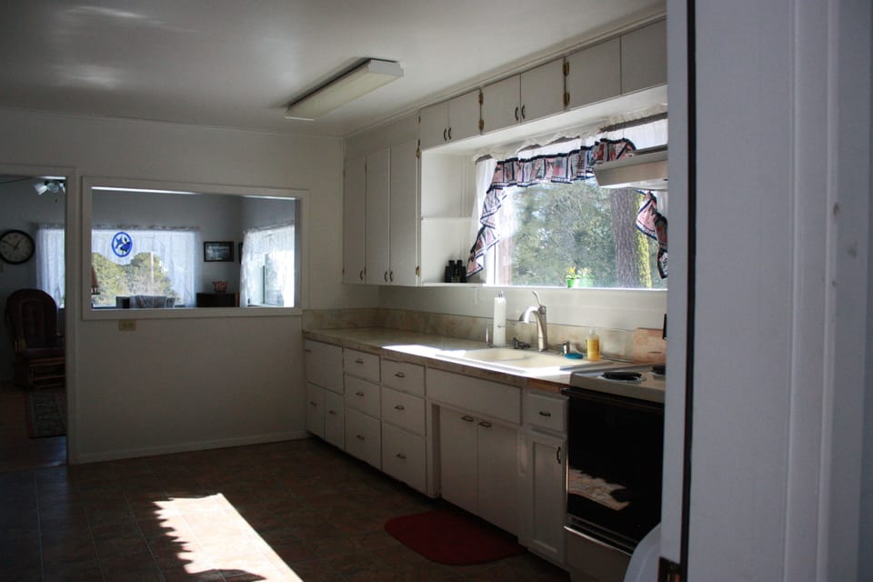 Welcome to the kitchen, fully stocked with dishes and cookware.