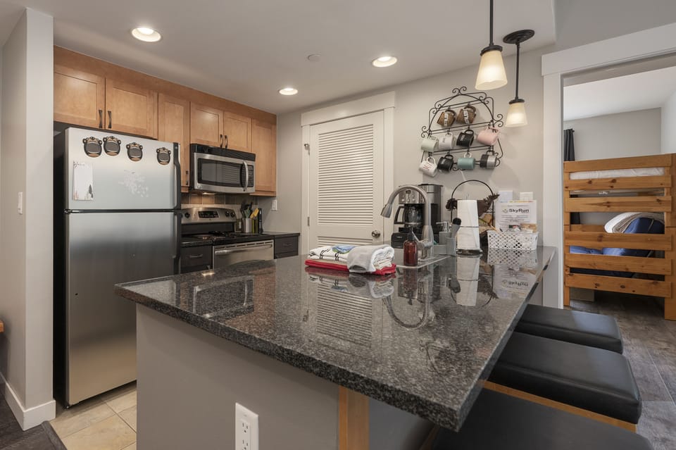 - Kitchen with granite counters, stainless steel appliances   - Fully stocked setup for cooking and dining with ease   - Breakfast bar with seating for casual family meals