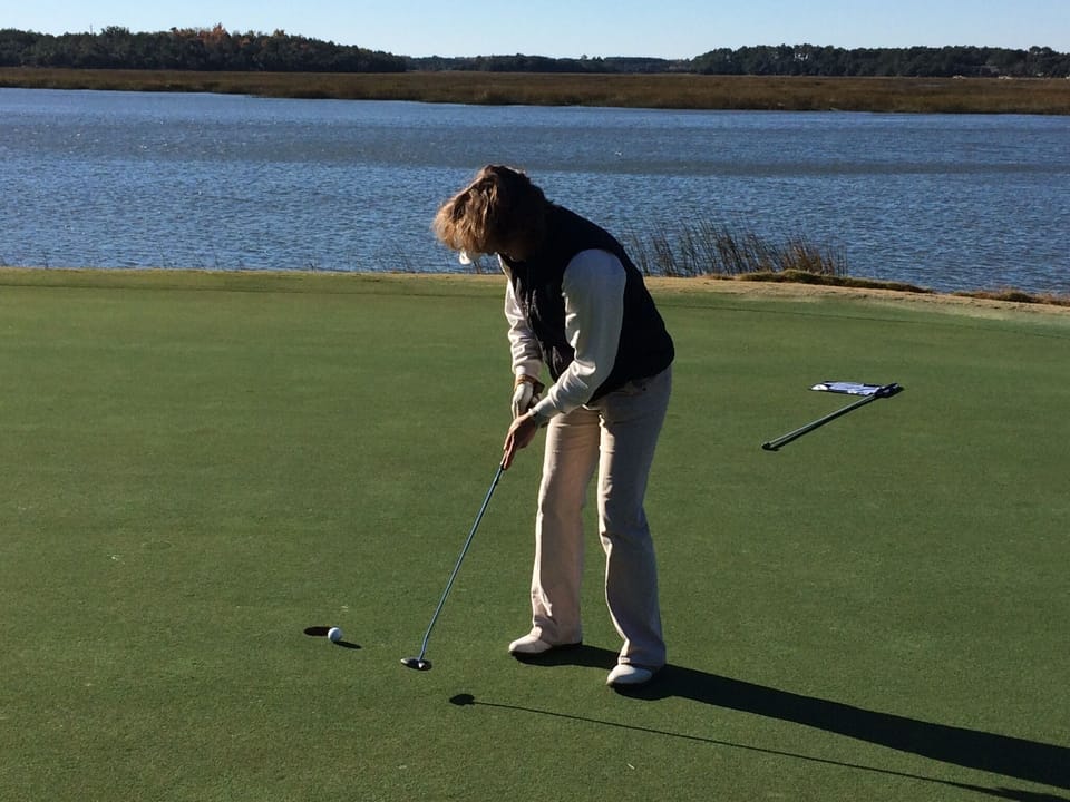 Golfer playing the 18th hole on the Cotton Dike golf course