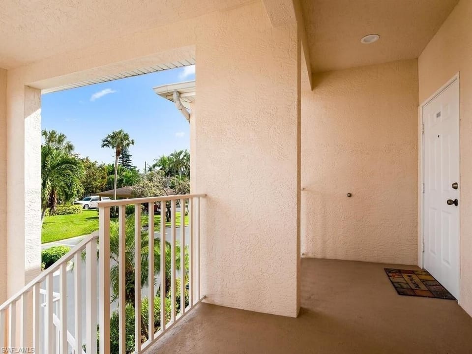 Covered lit stairwell into condo.