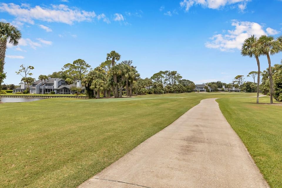 Enjoy scenic walks or golf cart rides along this beautiful fairway path.