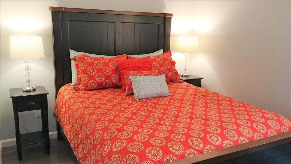 Luxury bedding. Queen bed. Closet. downstairs.