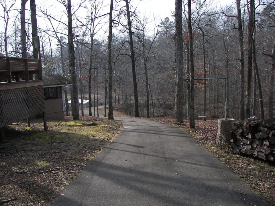 Winter time view of path from house to boathouse.  Swingset on the right. 