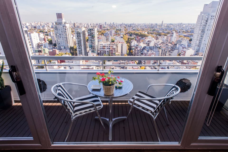 Drink in hand and Buenos Aires at your feet