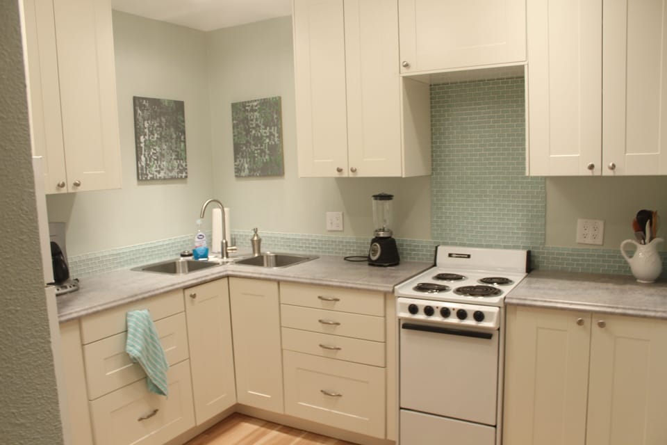 Kitchen is fully equipped with coffee maker, toaster, blender and microwave oven