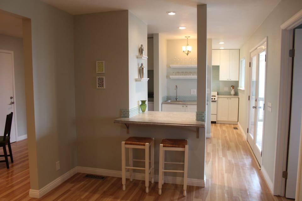 Looking into bar area with kitchen beyond. 