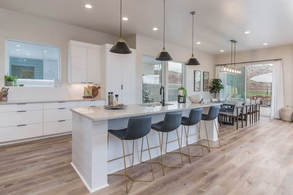Kitchen/ dining area with sliding door to back patio/pool area