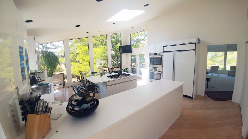 Another view of Kitchen with high sloped ceiling.